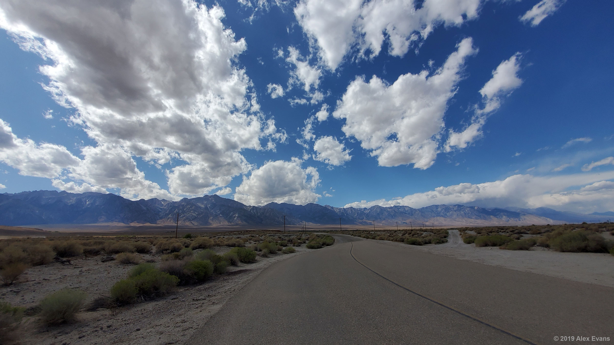 Clouds above desert road