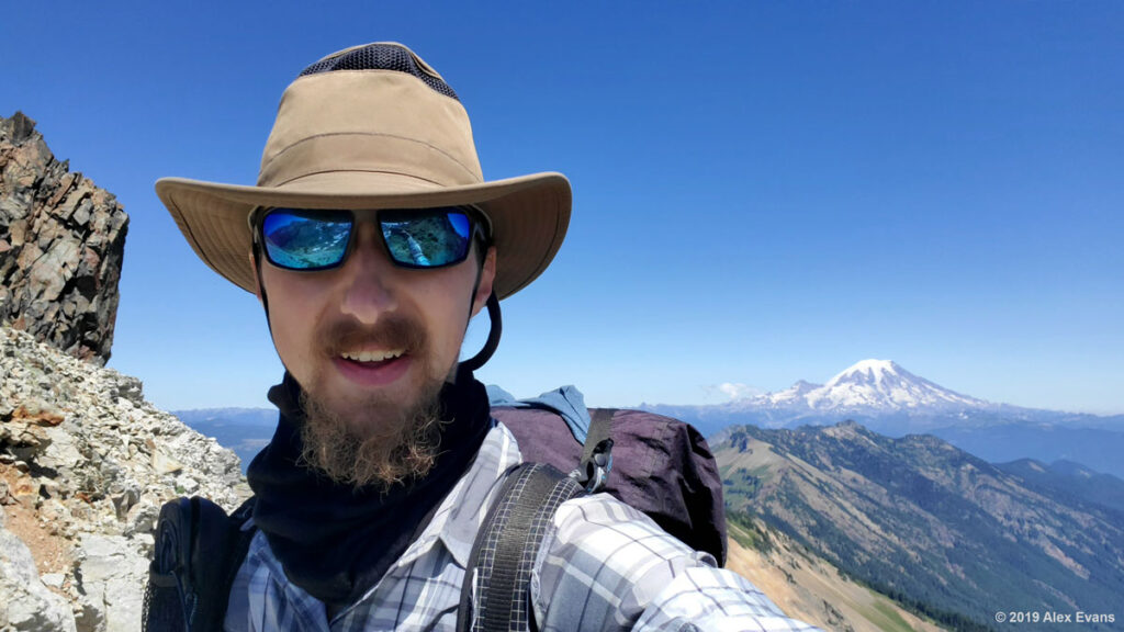 Hiker on the Knife Edge with Mt Rainier in the background